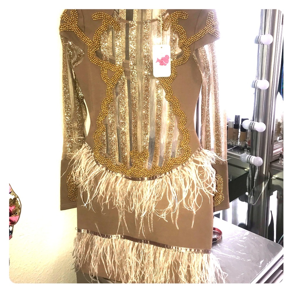 Gold dress with feathers